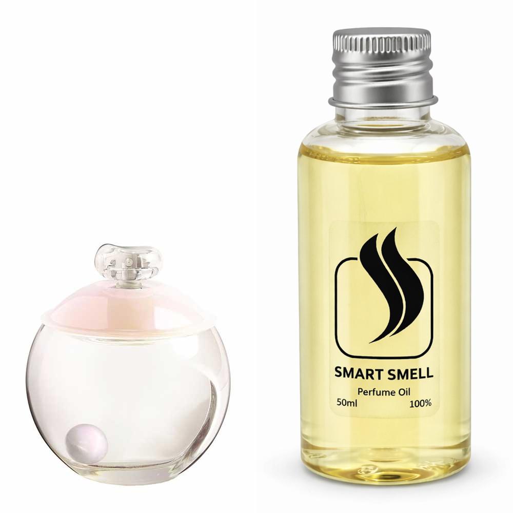 Парфюмерный концентрат 50 мл c аналогом Cacharel, Noa. Товар на фото справа, слева - пример оригинального флакона.